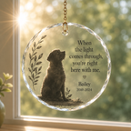 Personalized pet memorial hanging ornament displayed in a sunny window