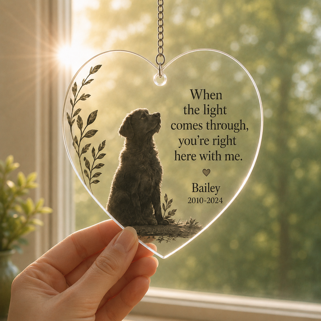 Close-up of personalized pet memorial ornament with light shining through